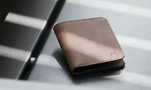 a wallet sitting at a tsa checkpoint - Can You Carry Your Wallet Through Airport Security?