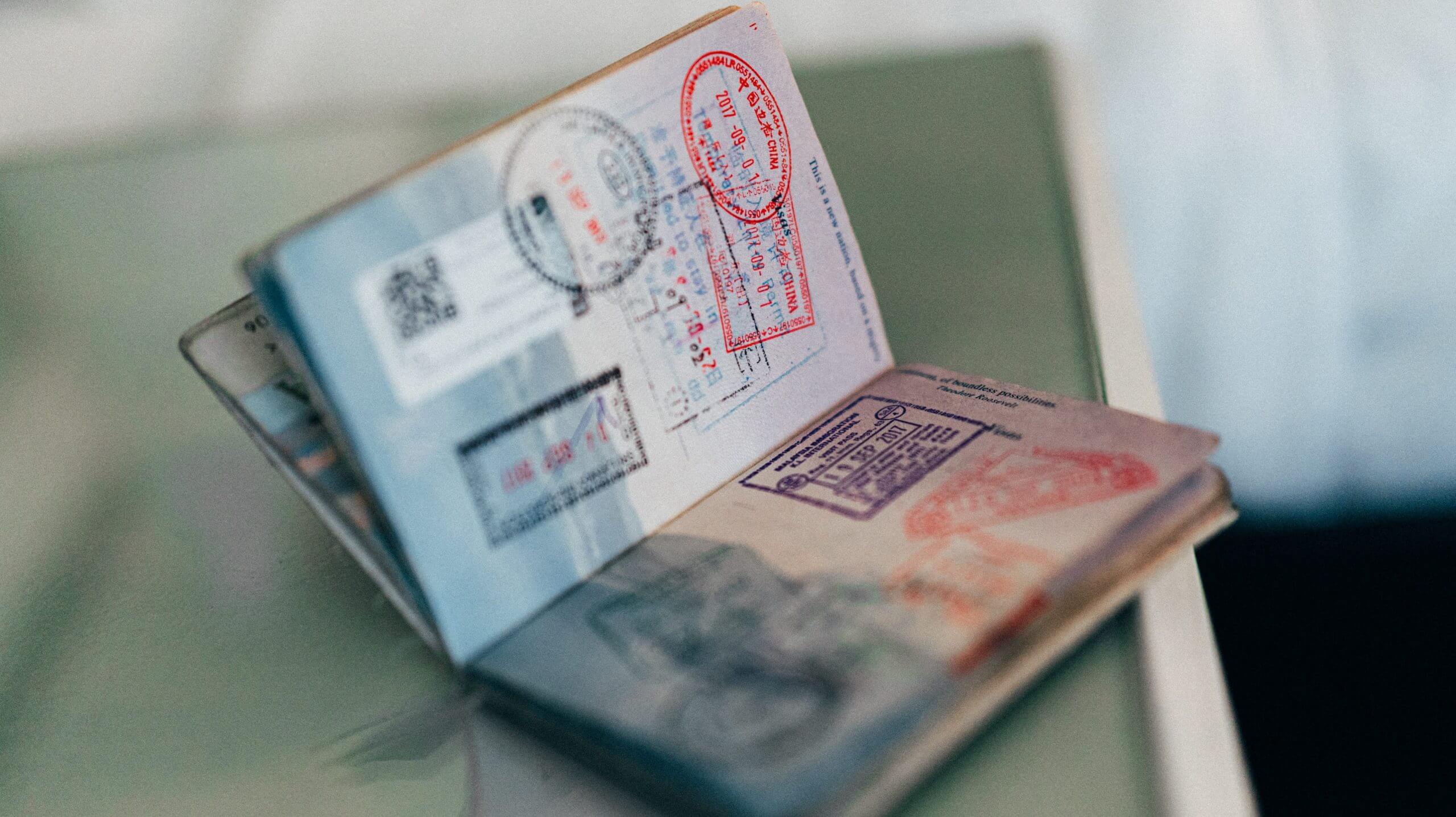 Passport full of stamps on a table