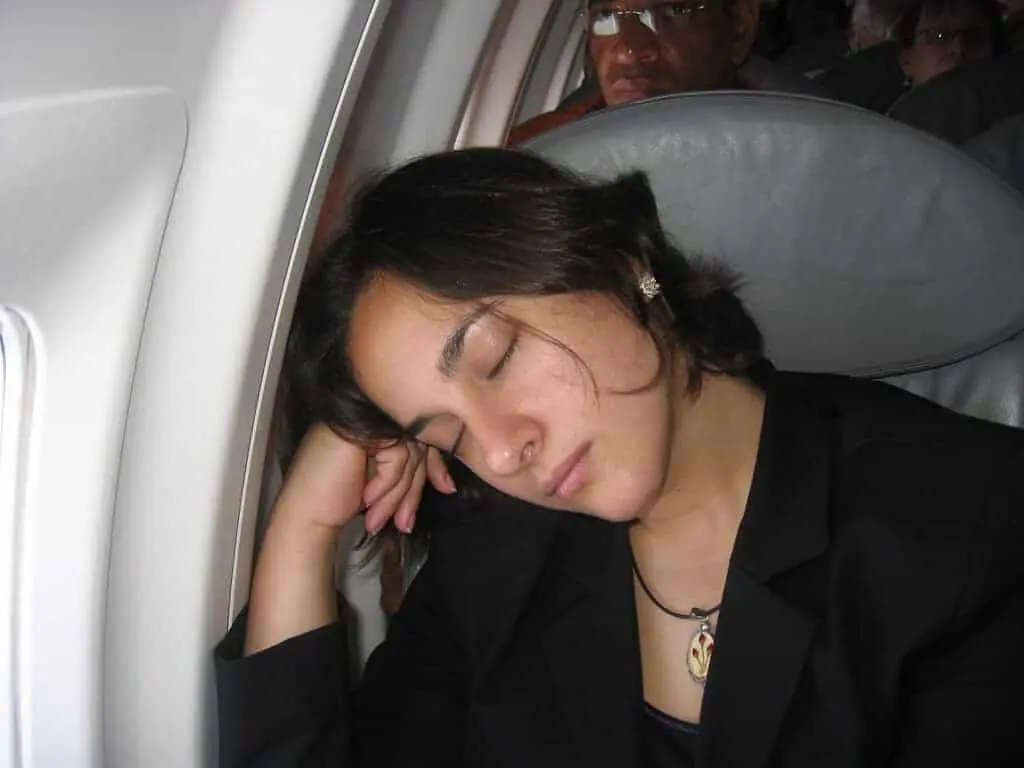 sleep on a plane economy class